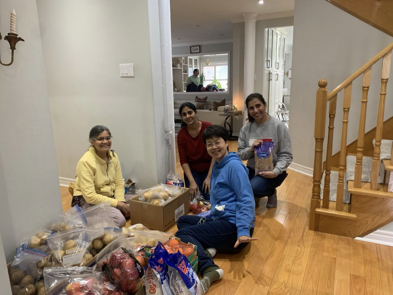 Stella donating and preparing free meals for low-income residents